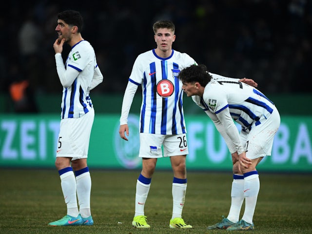 Hertha Berlin's Andreas Bouchalakis, Gustav Christensen and Fabian Reese look dejected after the match on January 31, 2024