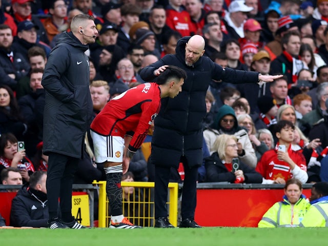 Manchester United's Lisandro Martinez with manager Erik ten Hag after sustaining an injury on February 4, 2024