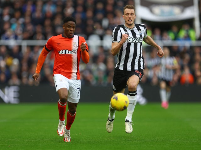 Luton Town's Chiedozie Ogbene in action with Newcastle United's Dan Burn on February 3, 2024