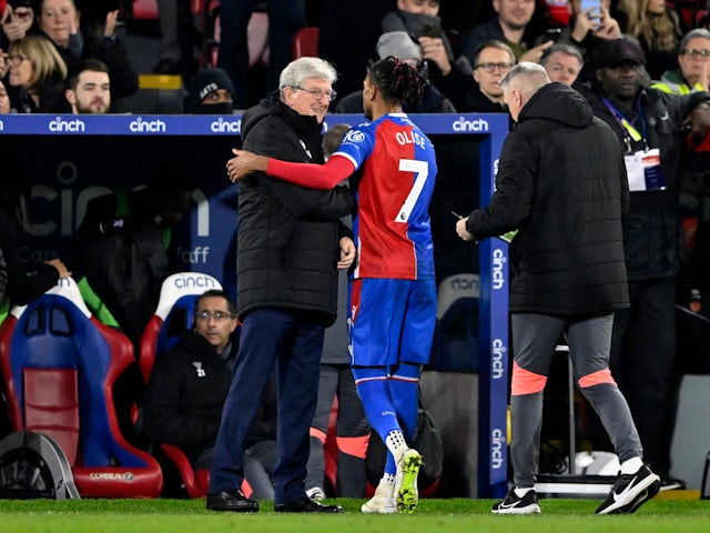 Crystal Palace's Michael Olise with manager Roy Hodgson as he is substituted on January 30, 2024