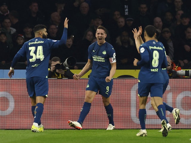 PSV Eindhoven's Luuk de Jong celebrates scoring their first goal with teammates on February 3, 2024