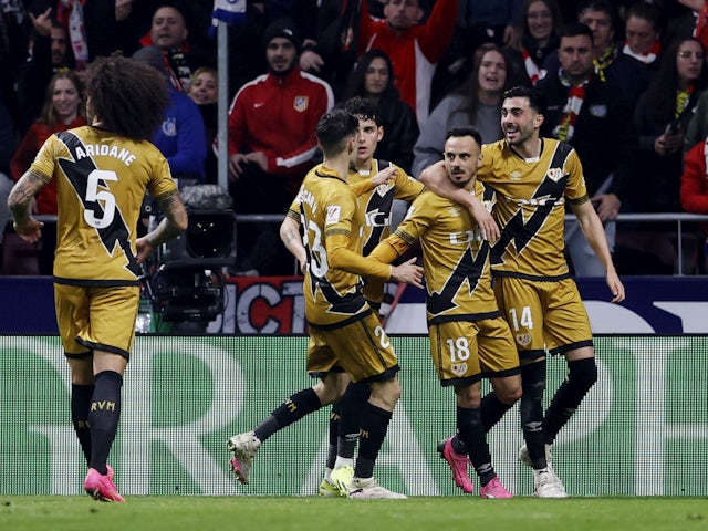Rayo Vallecano's Alvaro Garcia celebrates scoring their first goal with teammates on January 31, 2024