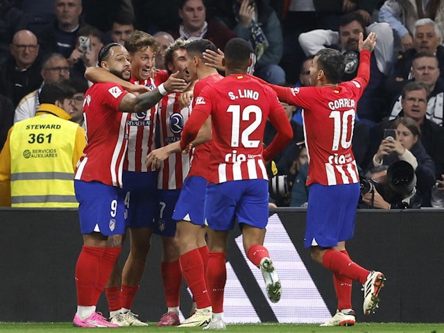 Atletico Madrid's Marcos Llorente celebrates scoring against Real Madrid on February 4, 2024