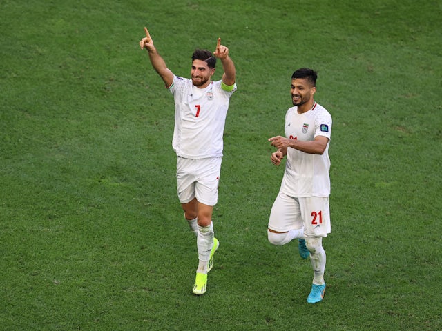 Alireza Jahanbakhsh and Mohammad Mohebbi celebrate the winning goal for Iran against Japan at the 2023 Asian Cup