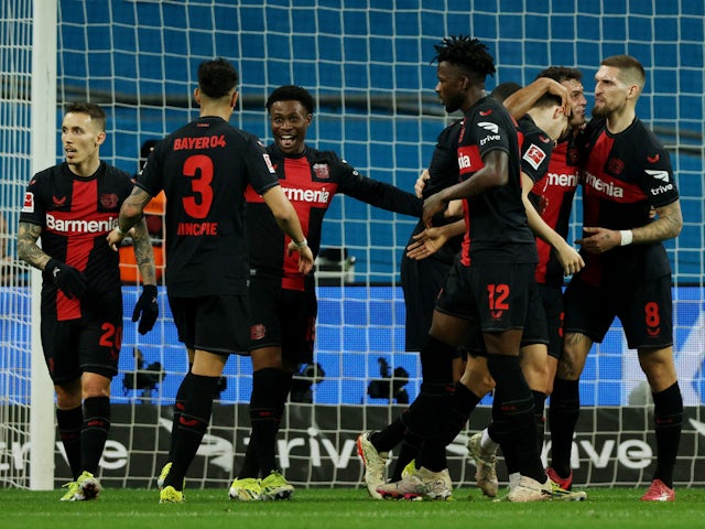 Bayer Leverkusen's Josip Stanisic celebrates scoring their first goal with teammates on February 10, 2024