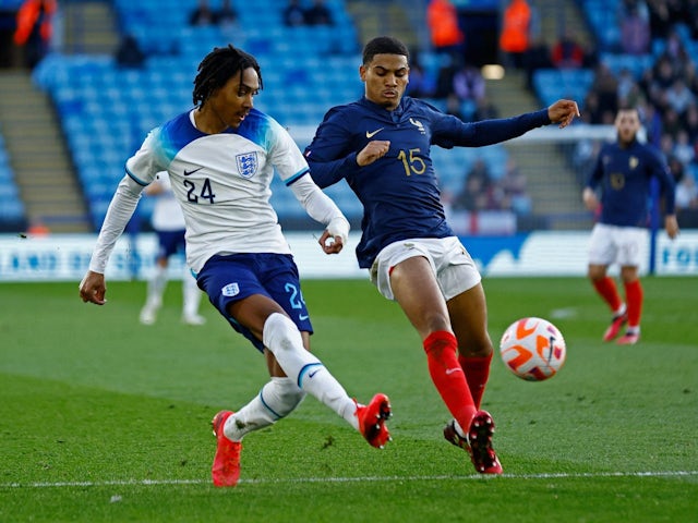 England's Djed Spence in action with France's Amine Adli on March 25, 2023
