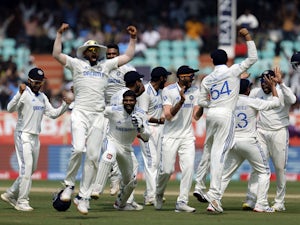 India overcome valiant England to win second Test