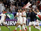 Jordan's Raja'ei Ayed and teammates celebrate after reaching the AFC Asian Cup final on February 6, 2024