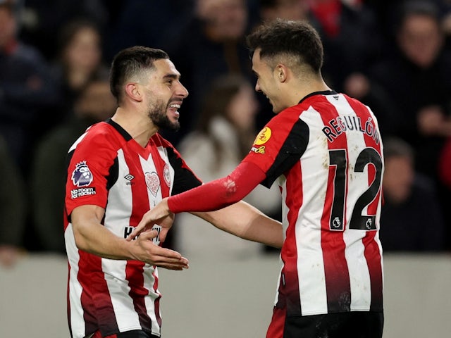 Brentford's Neal Maupay celebrates scoring their first goal with Sergio Reguilon on February 5, 2024