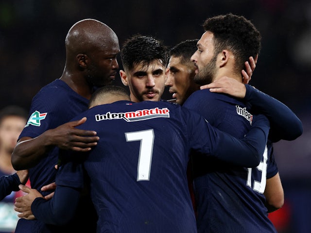 Paris Saint-Germain's (PSG) Goncalo Ramos celebrates scoring their third goal with teammates on February 7, 2024