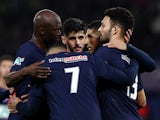 Paris Saint-Germain's (PSG) Goncalo Ramos celebrates scoring their third goal with teammates on February 7, 2024