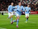 Manchester City's Phil Foden celebrates scoring their second goal with Erling Haaland and Julian Alvarez on February 5, 2024