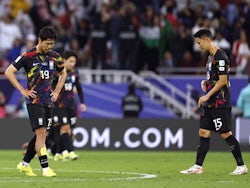 South Korea's Kim Young-Gwon and Jung Seung-Hyun look dejected after being eliminated from the AFC Asian Cup on February 6, 2024