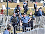 Police help clear the area after shots were fired after the celebration the celebration of the Kansas City Chiefs winning Super Bowl LVIII on February 14, 2024 