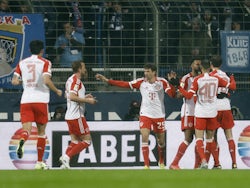 Bayern Munich's Jamal Musiala celebrates scoring their first goal with teammates on February 18, 2024