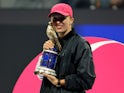 Poland's Iga Swiatek poses with the trophy after winning the Qatar Open on February 17, 2024
