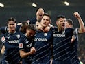VfL Bochum's Keven Schlotterbeck celebrates scoring their second goal with teammates on February 18, 2024