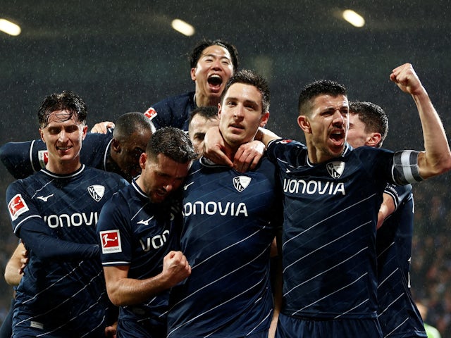 VfL Bochum's Keven Schlotterbeck celebrates scoring their second goal with teammates on February 18, 2024