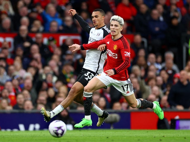 Manchester United's Alejandro Garnacho in action with Fulham's Antonee Robinson on February 24, 2024