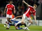 Porto's Fernando (L) and Arsenal's Nicklas Bendtner fight for the ball during their Champions League match on February 17, 2010