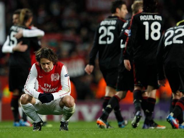 Arsenal's Tomas Rosicky reacts after being defeated by AC Milan in their Champions League last 16 second leg on March 6, 2012