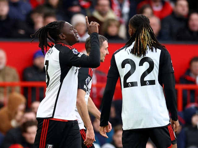 Fulham's Calvin Bassey celebrates scoring their first goal with Timothy Castagne and Alex Iwobi on February 24, 2024