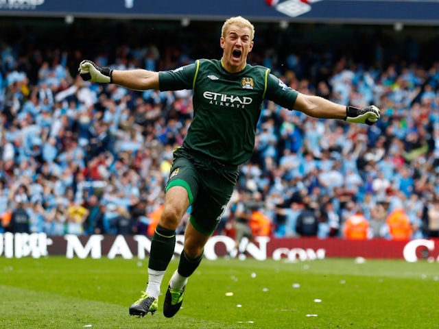 Manchester City's Joe Hart celebrates his sides third goal on May, 13, 2012