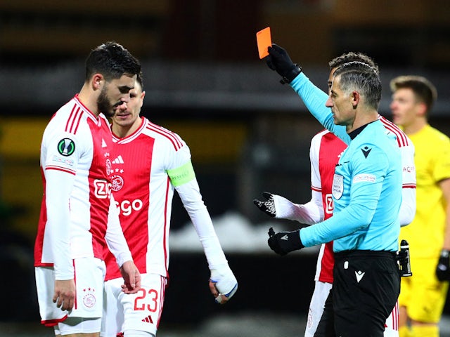 Ajax's Josip Sutalo is shown a red card by referee Anastasios Sidiropoulos on February 22, 2024