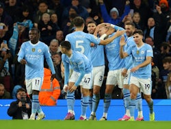 Manchester City's Erling Haaland celebrates scoring their first goal with teammates on February 20, 2024