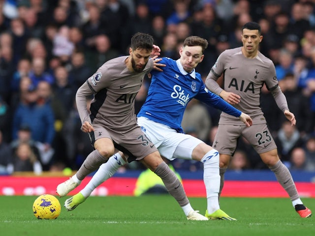 Tottenham Hotspur's Rodrigo Bentancur in action with Everton's James Garner on February 3, 2024