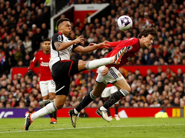 Fulham's Rodrigo Muniz in action with Manchester United's Victor Lindelof on February 24, 2024