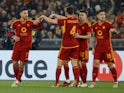 Roma's Lorenzo Pellegrini celebrates scoring their first goal with teammates on February 22, 2024