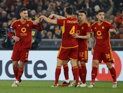Roma's Lorenzo Pellegrini celebrates scoring their first goal with teammates on February 22, 2024