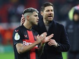 Bayer Leverkusen coach Xabi Alonso celebrates with Exequiel Palacios after the match on December 6, 2023