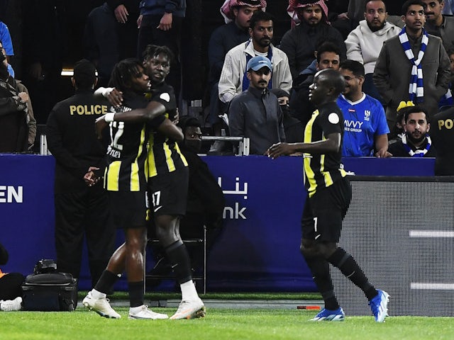 Al Ittihad's N'Golo Kante celebrates scoring their first goal with Marwan Al Sahaf and Zakaria Al Hawsawi on March 1, 2024