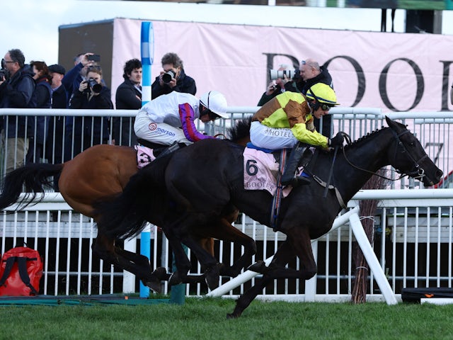 Paul Townend riding Galopin Des Champs in action on their way to winning the 15:30 The Cheltenham Gold Cup ahead of second placed Harry Cobden riding Bravemansgame
