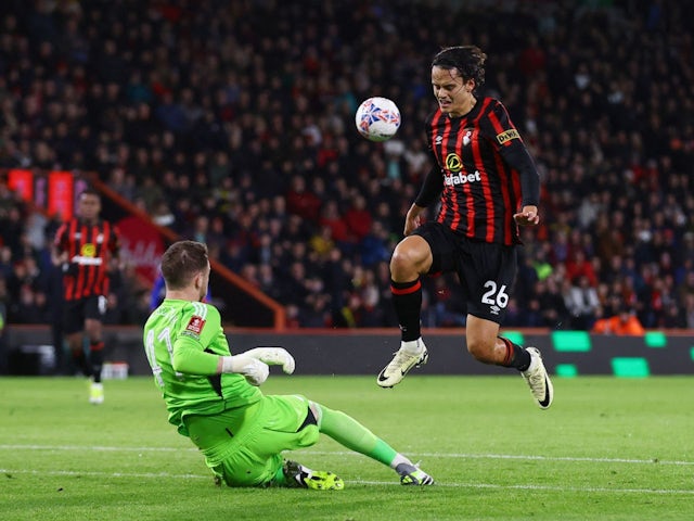 Leicester City's Jakub Stolarczyk in action with AFC Bournemouth's Enes Unal on February 27, 2024