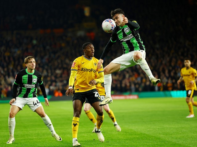 Brighton & Hove Albion's Facundo Buonanotte in action with Wolverhampton Wanderers' Jean-Ricner Bellegarde on February 28, 2024