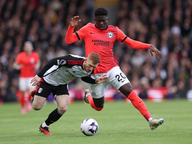 Fulham's Harrison Reed in action with Brighton & Hove Albion's Carlos Baleba on March 2, 2024