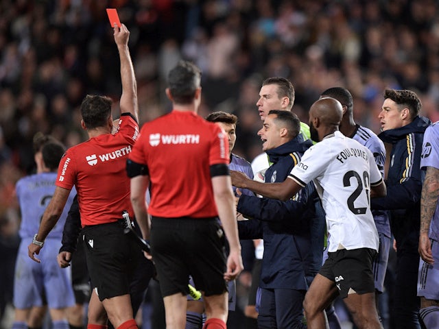 Real Madrid's Jude Bellingham is shown a red card by referee Jesus Gil Manzano after the match on March 2, 2024