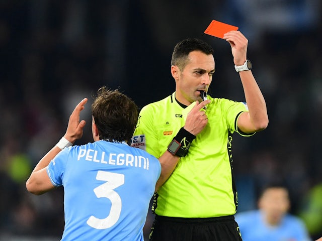 Lazio's Luca Pellegrini is shown a red card by referee Marco Di Bello on March 1, 2024