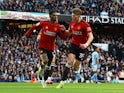 Manchester United's Marcus Rashford celebrates scoring their first goal with Scott McTominay on March 3, 2024