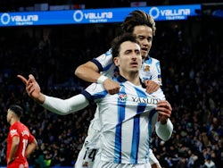 Real Sociedad's Mikel Oyarzabal celebrates scoring their first goal with Takefusa Kubo on February 27, 2024