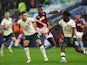 Hibernian's William Fish and Rocky Bushiri in action with Aston Villa's Jhon Duran on August 31, 2023