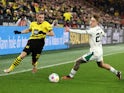 Borussia Dortmund's Julian Ryerson in action with Borussia Moenchengladbach's Luca Netz on March 6, 2024