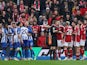 Nottingham Forest players surround referee Michael Salisbury as Brighton & Hove Albion players celebrate scoring on March 10, 2024