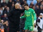 Manchester City's Ederson with manager Pep Guardiola after being substituted after sustaining an injury on March 10, 2024