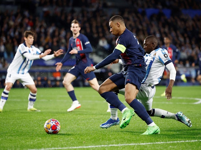 Real Sociedad's Hamari Traore in action with Paris Saint-Germain's Kylian Mbappe on March 5, 2024