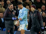 Manchester City's Matheus Nunes walks off the pitch after sustaining an injury on March 6, 2024