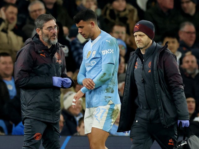 Manchester City's Matheus Nunes walks off the pitch after sustaining an injury on March 6, 2024